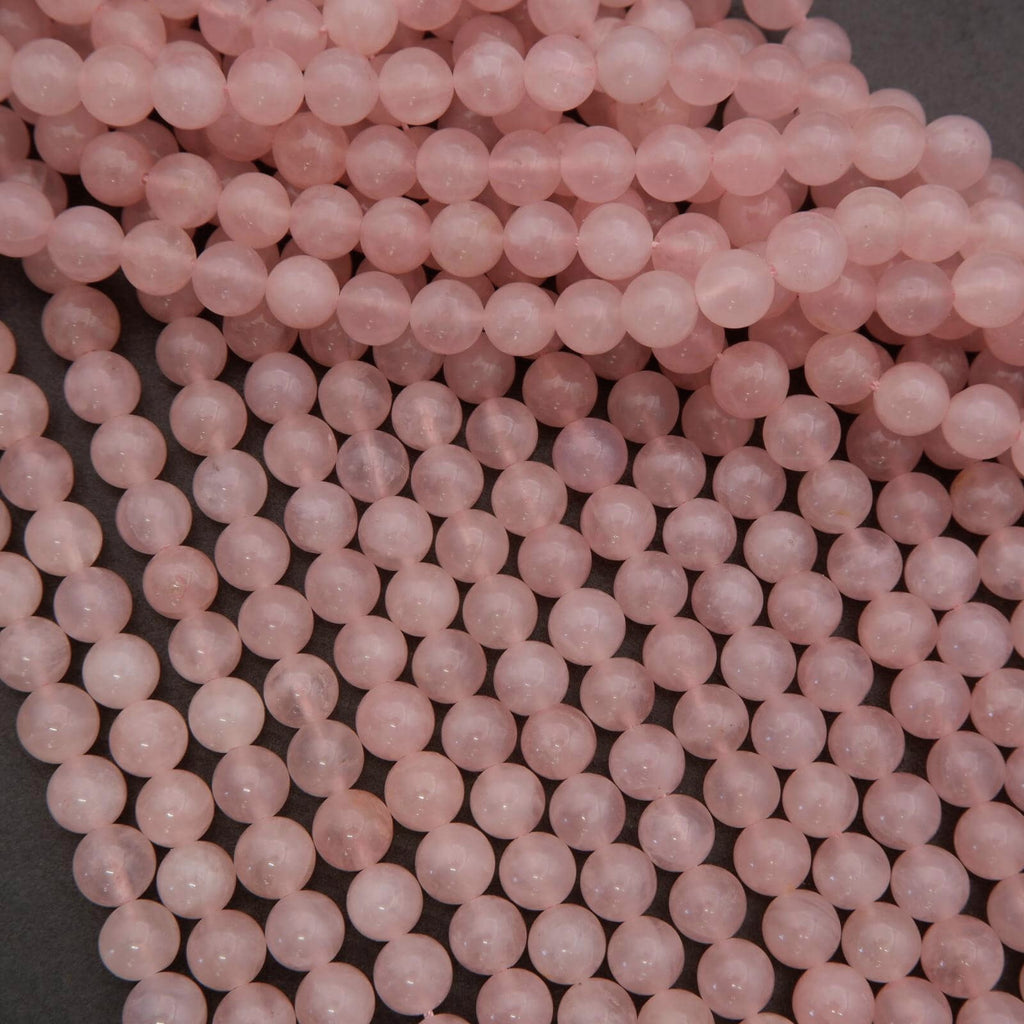 Close-up of pink beads on a dark background