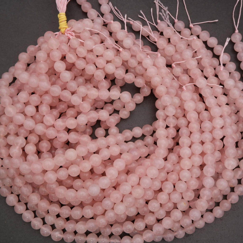 String of pink beads on a dark background
