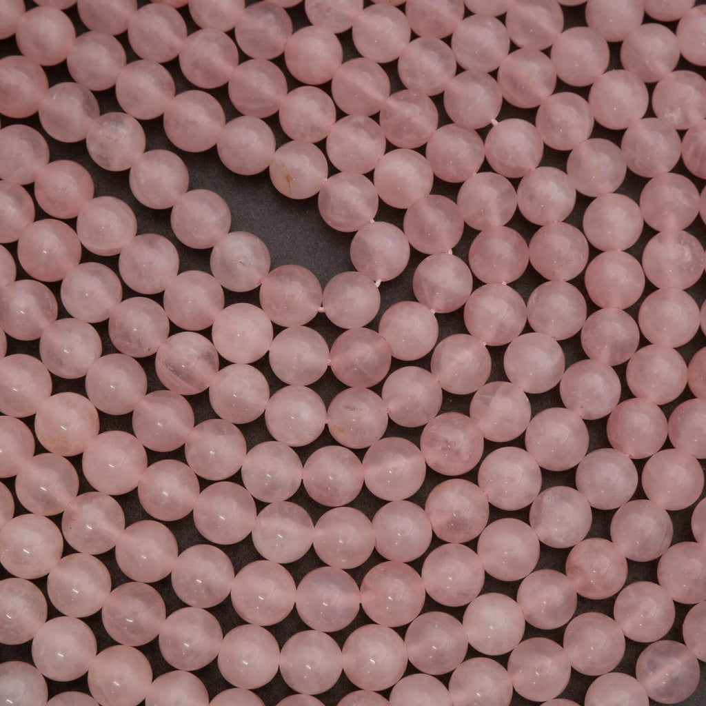 Close-up of pink beads on a dark background