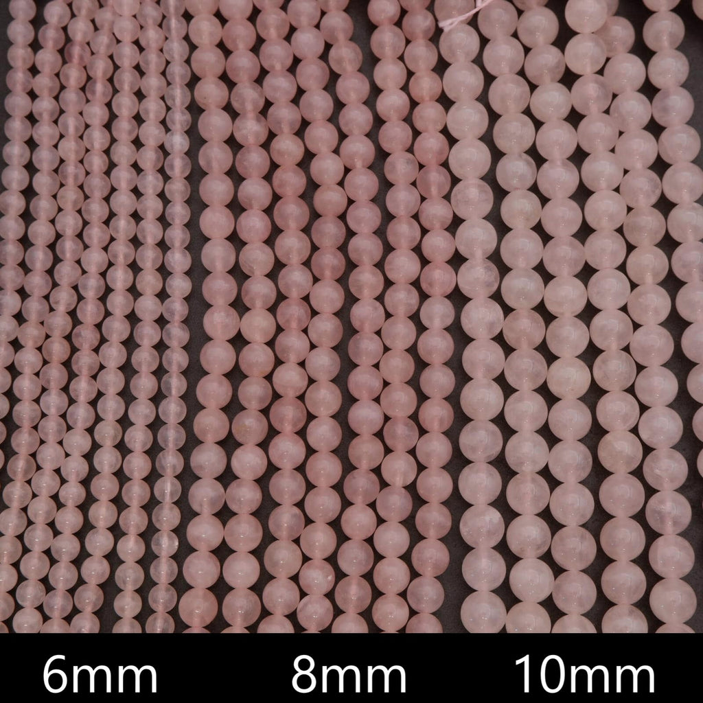 Close-up of pink beads with size labels 6mm, 8mm, and 10mm on a dark background.