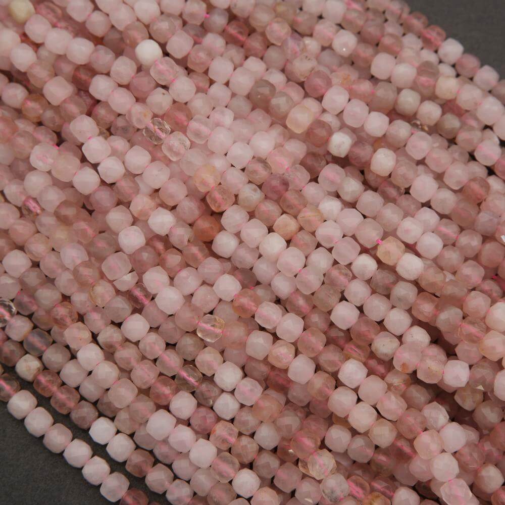 Close-up of pink and white beads on a dark background