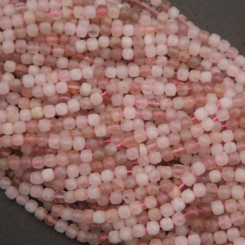 Close-up of pink beads with a dark background