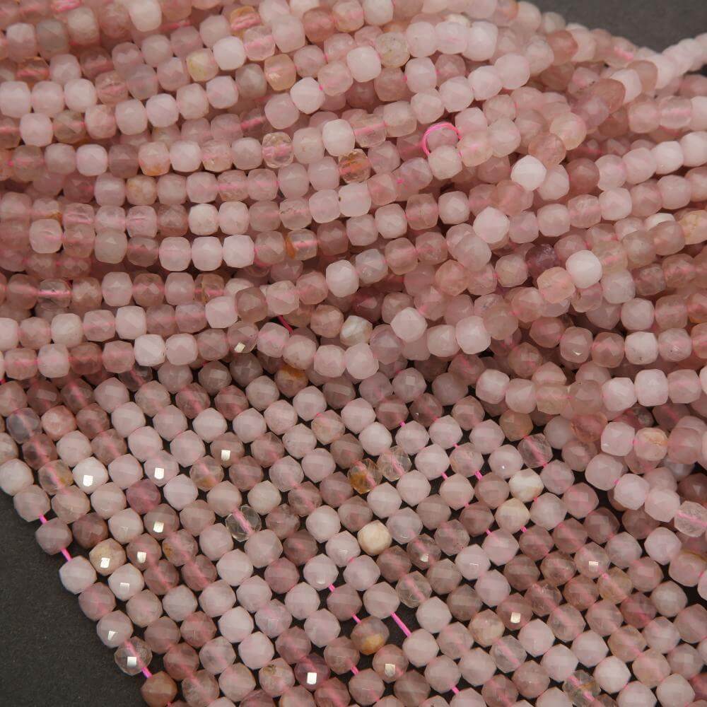 Close-up of pink beads on a dark background