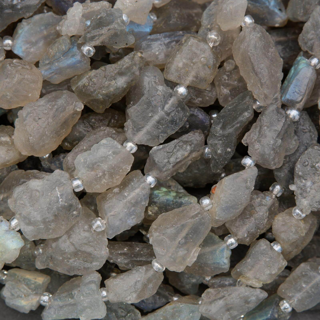 Close-up of raw labradorite stones with a dark background