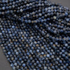 Close-up of blue faceted beads on a gray background