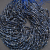String of blue beads on a gray background