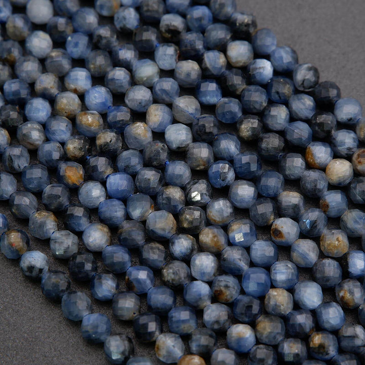 Close-up of blue faceted beads on a dark gray background