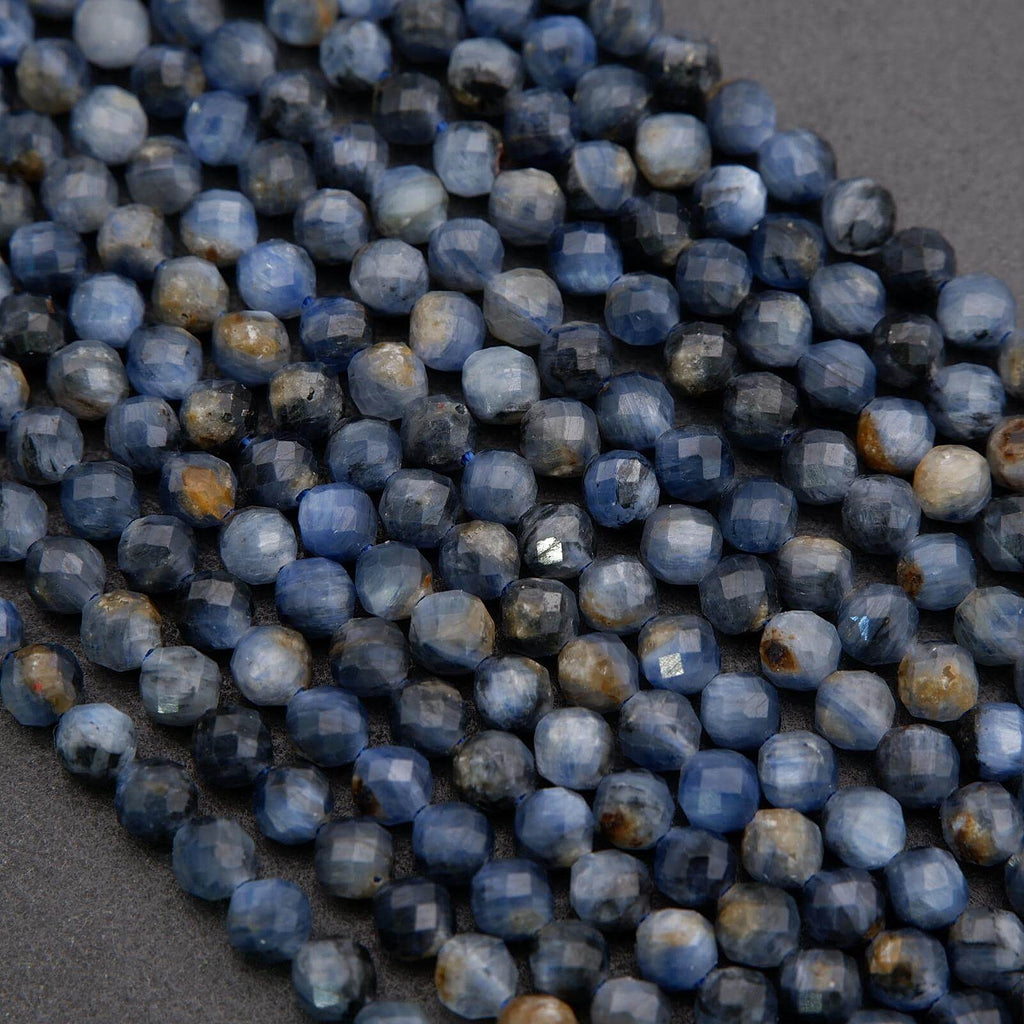 Close-up of blue faceted beads on a dark gray background