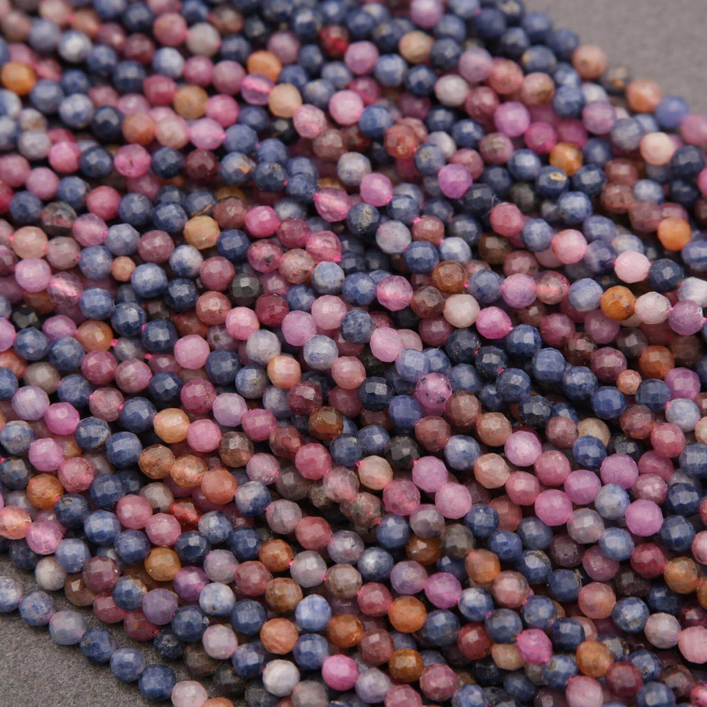 Close-up of multicolored round beads on a gray surface