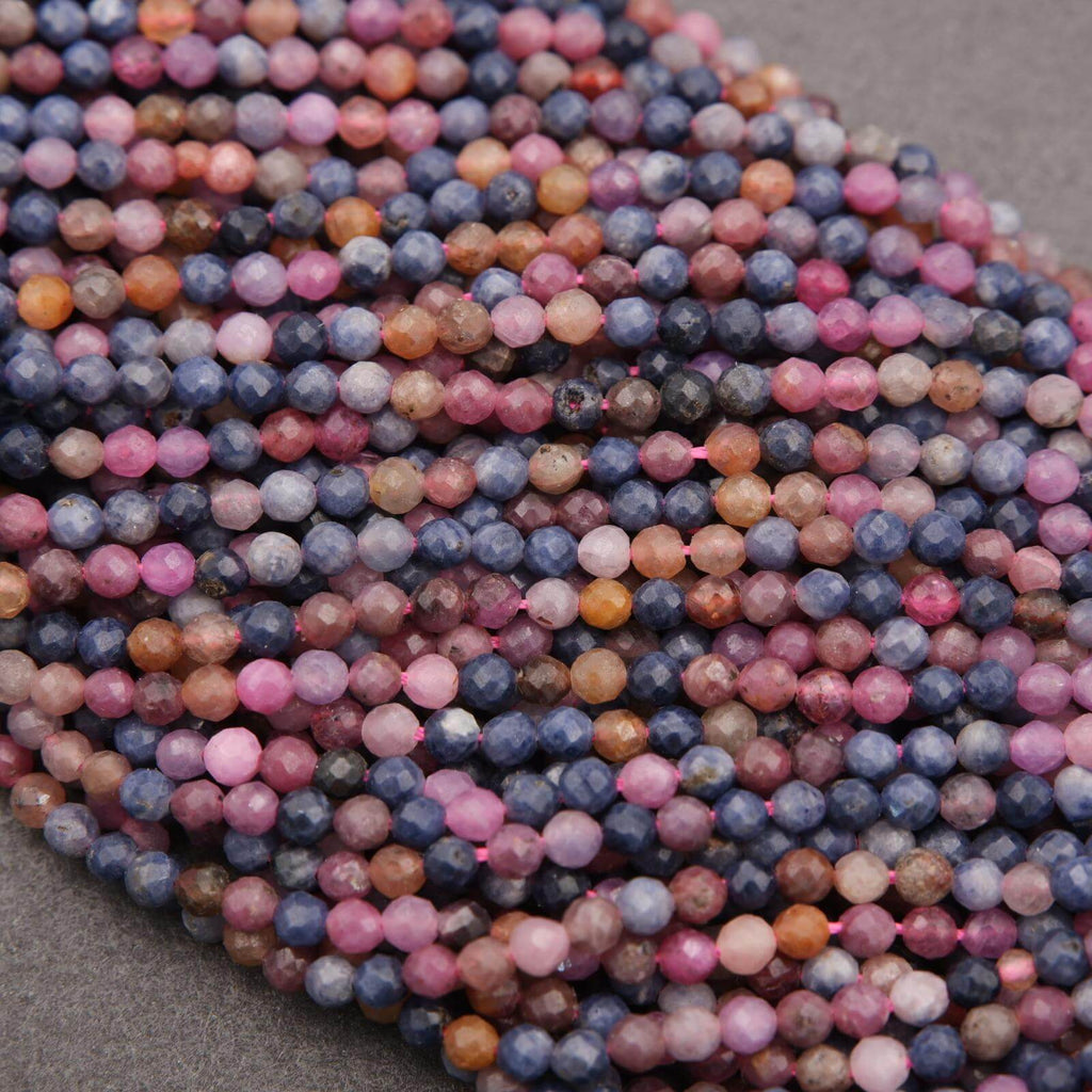 Close-up of multicolored beads on a gray surface