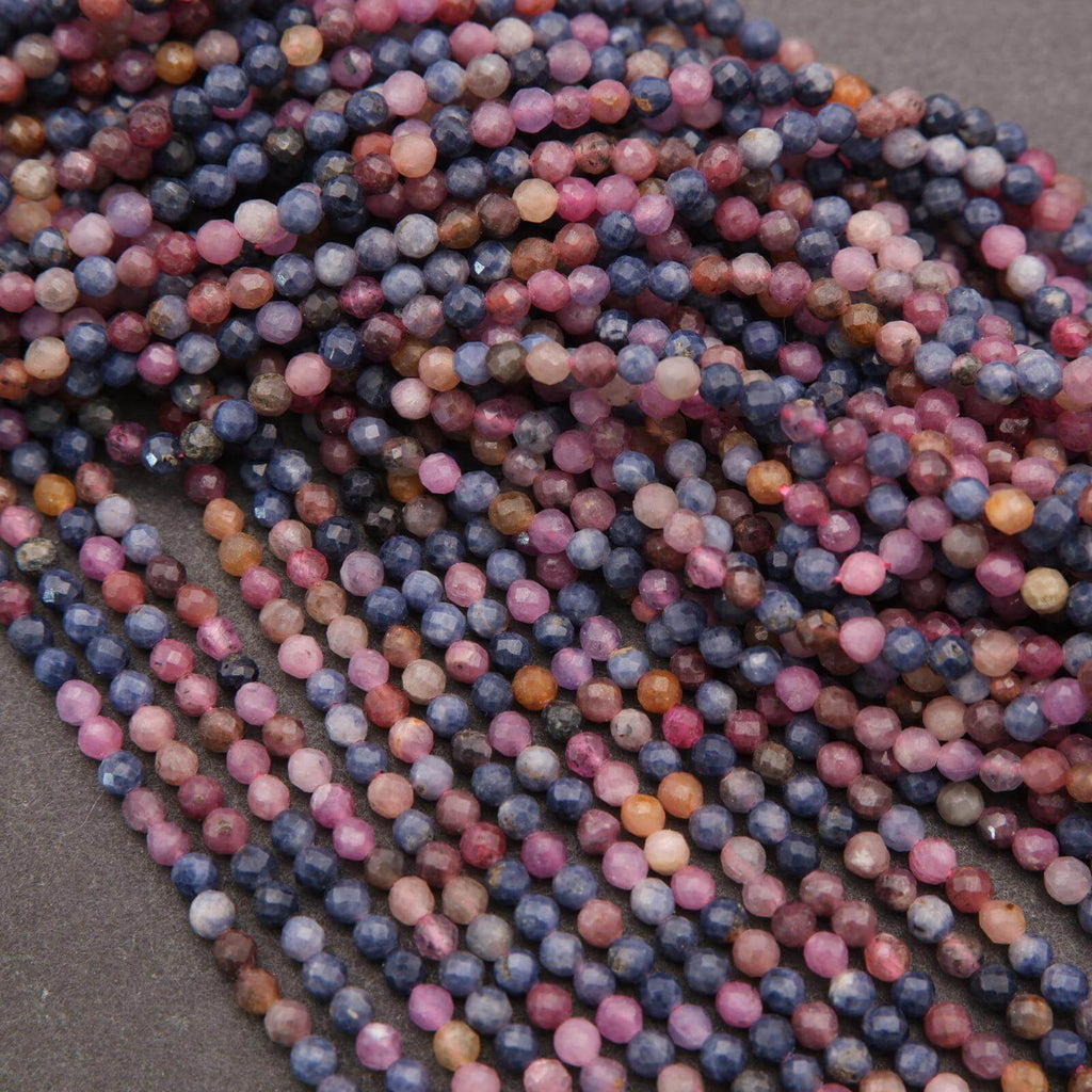 Close-up of multicolored beads on a dark surface