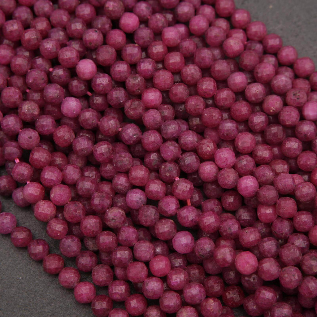 Close-up of purple beads on a dark surface