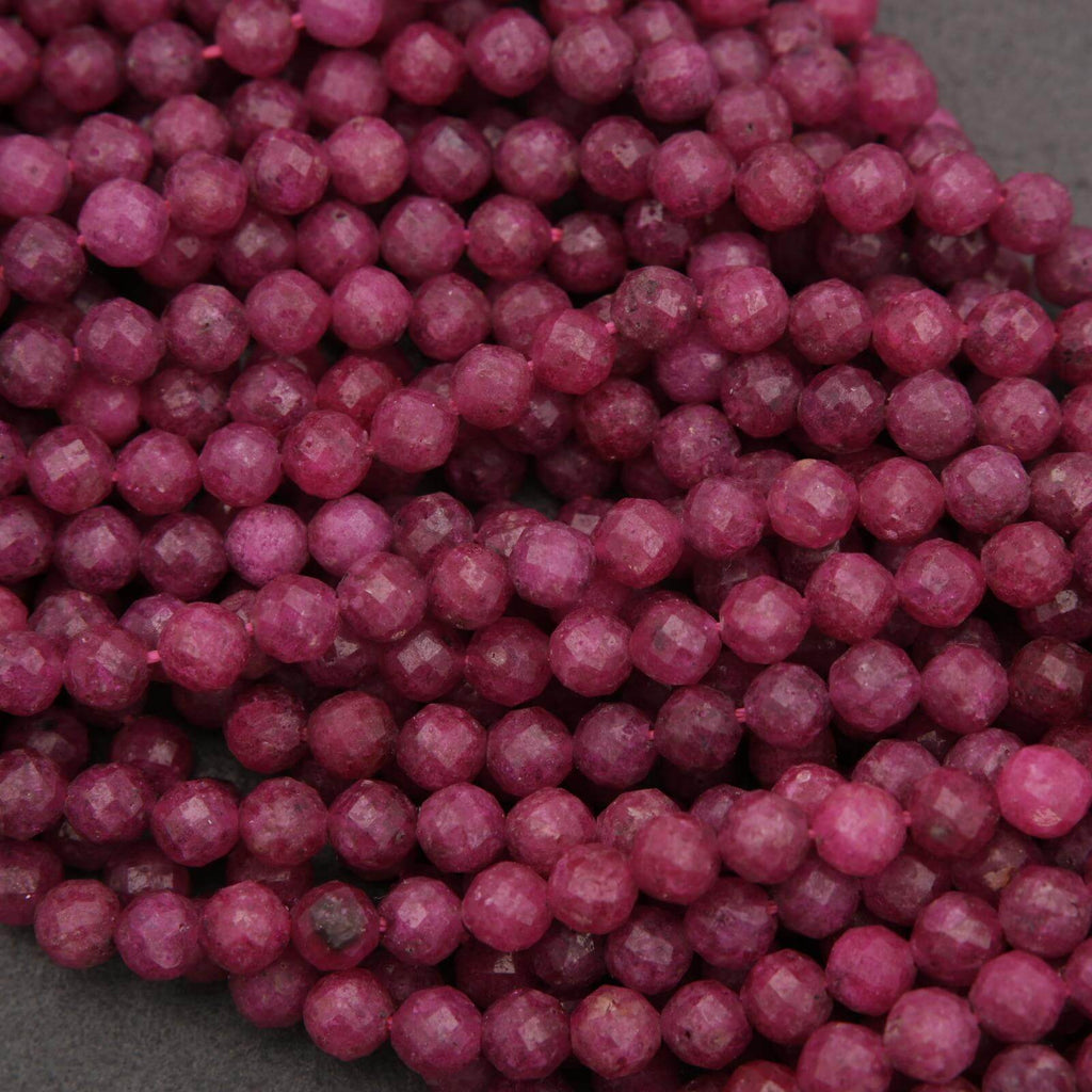 Close-up of purple beads on a gray background