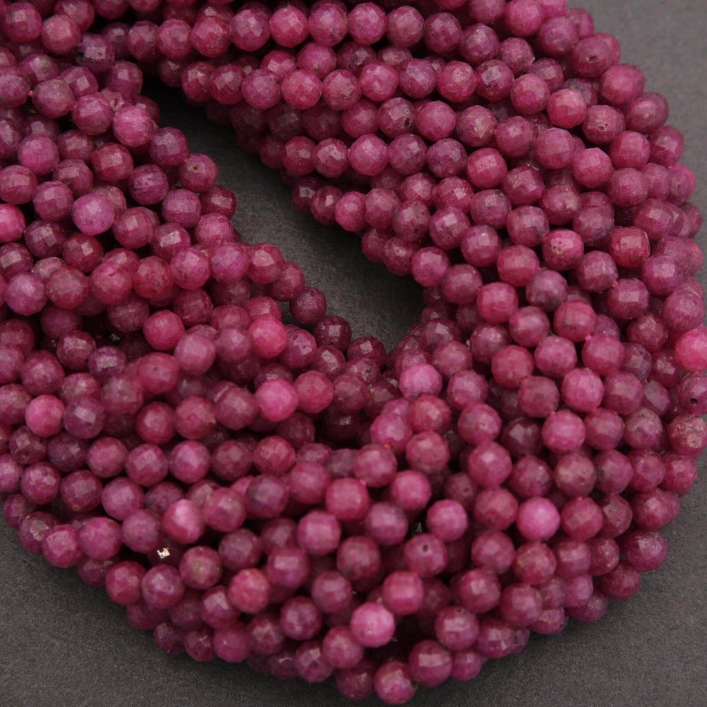 Close-up of a string of pink beads on a dark background