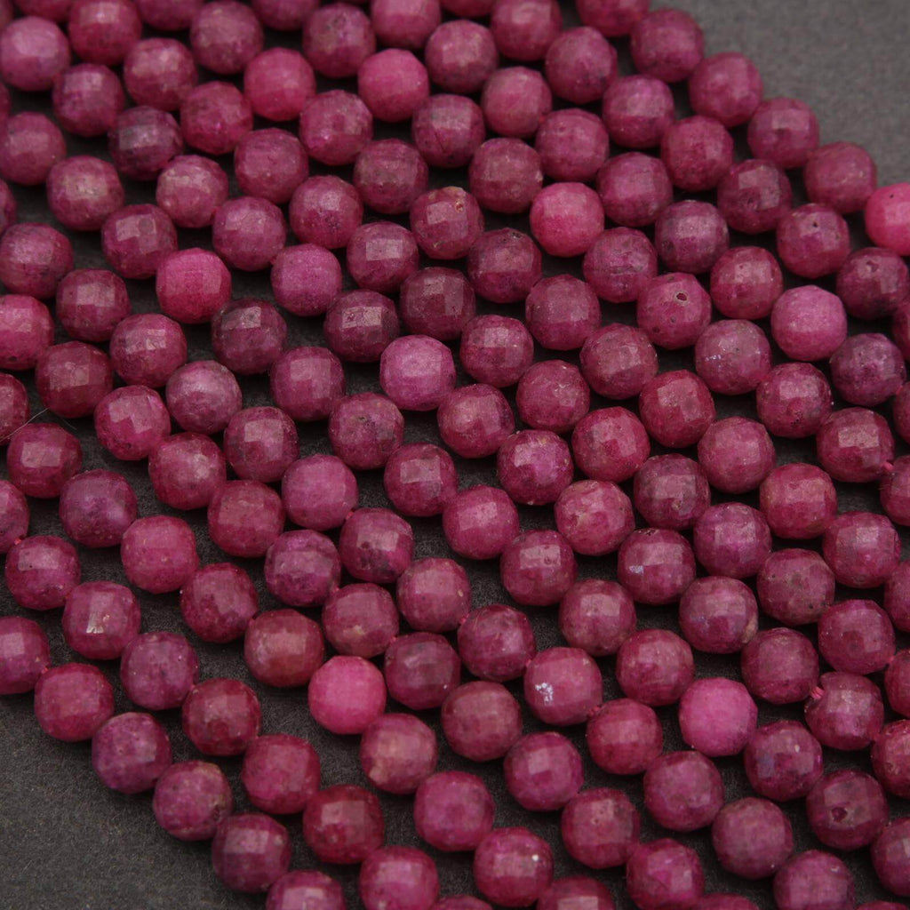 Close-up of pink beads on a dark surface