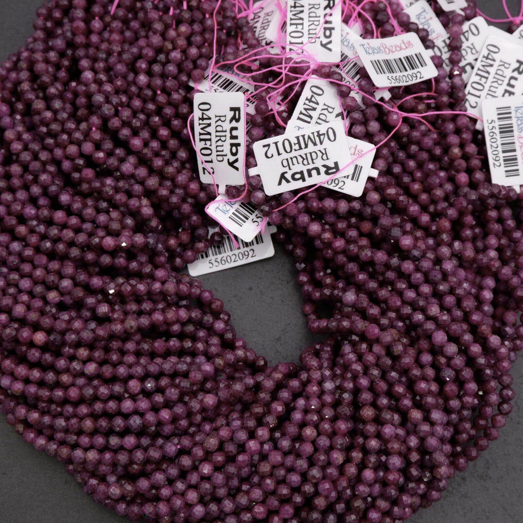 Purple beads with tags on a gray background