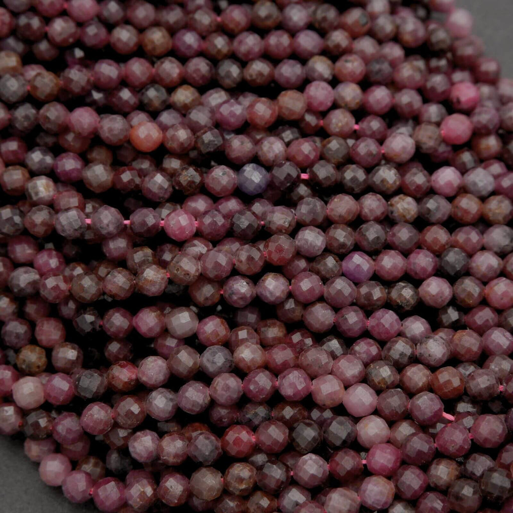 Close-up of faceted purple beads on a dark background