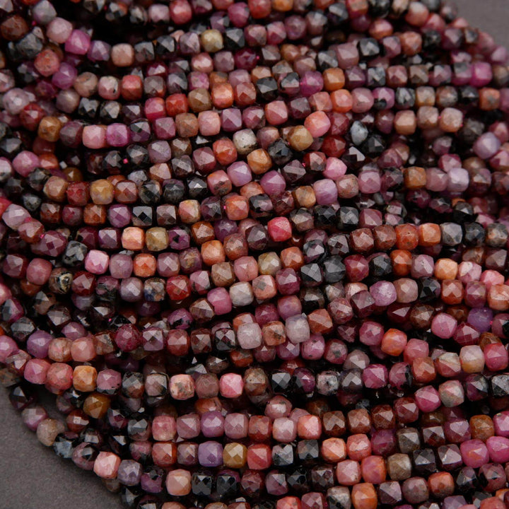 Faceted ruby gemstone beads with natural inclusions and subtle sparkle.