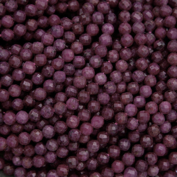 Close-up of purple beads with a dark background