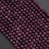 Close-up of purple beads on a dark background