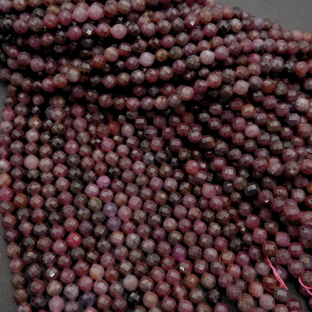 Close-up of a string of pink and brown faceted beads.