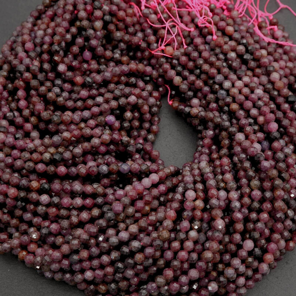 String of purple beads on a dark background