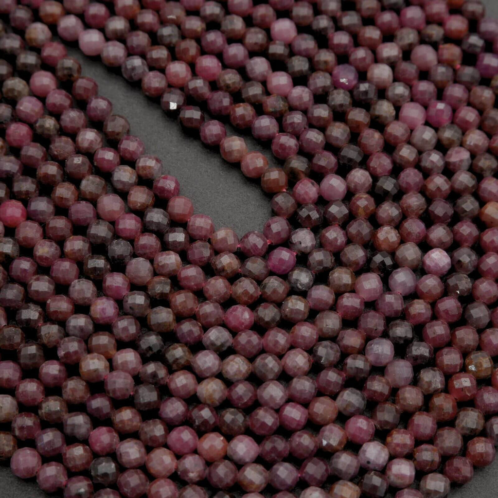 Close-up of pink and brown beads on a dark background