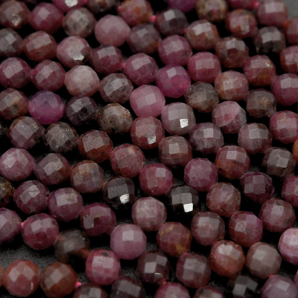 Close-up of faceted purple beads on a dark background