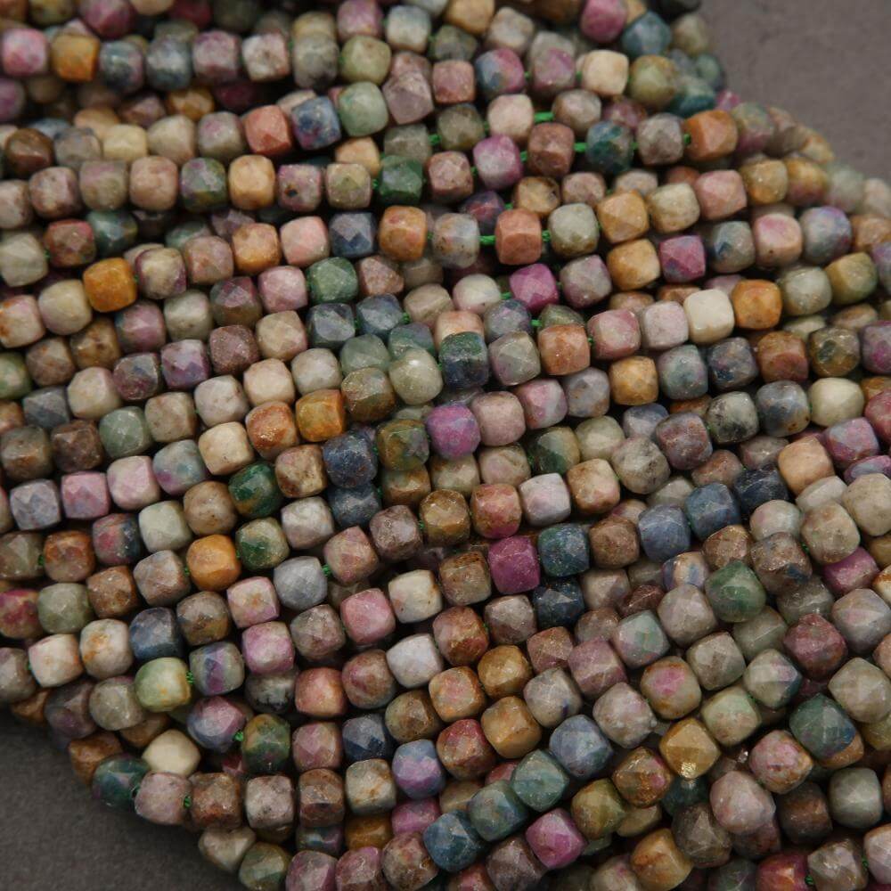 Close-up of multicolored square beads on a dark background