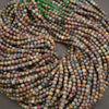 Multicolored square beads on a string against a neutral background