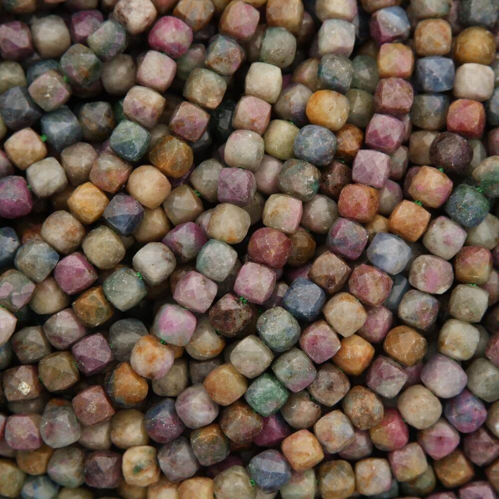 Close-up of multicolored small cube-shaped beads.