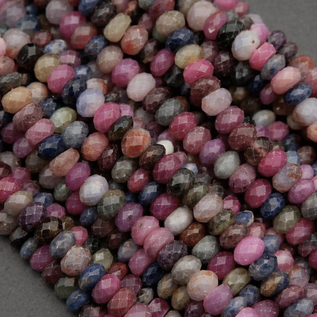 Faceted ruby and sapphire rondelle beads with multicolor hues and natural inclusions