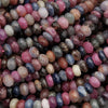 Natural ruby sapphire rondelle beads with faceted surfaces and rich color variations