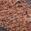 Clear faceted beads with brown needles.