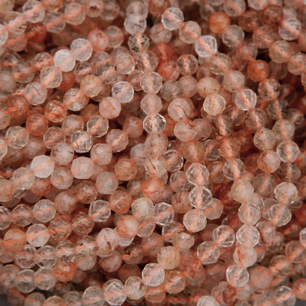 Clear faceted beads with brown needles.