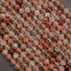 Clear faceted beads with brown needles.