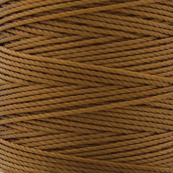 Close-up of antique gold 3-ply bonded nylon S-Lon Bead Cord on spool