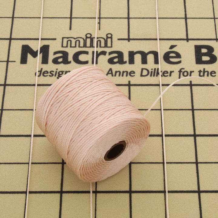 Spool of natural S-Lon Bead Cord Tex 210 nylon beading cord, 77 yards