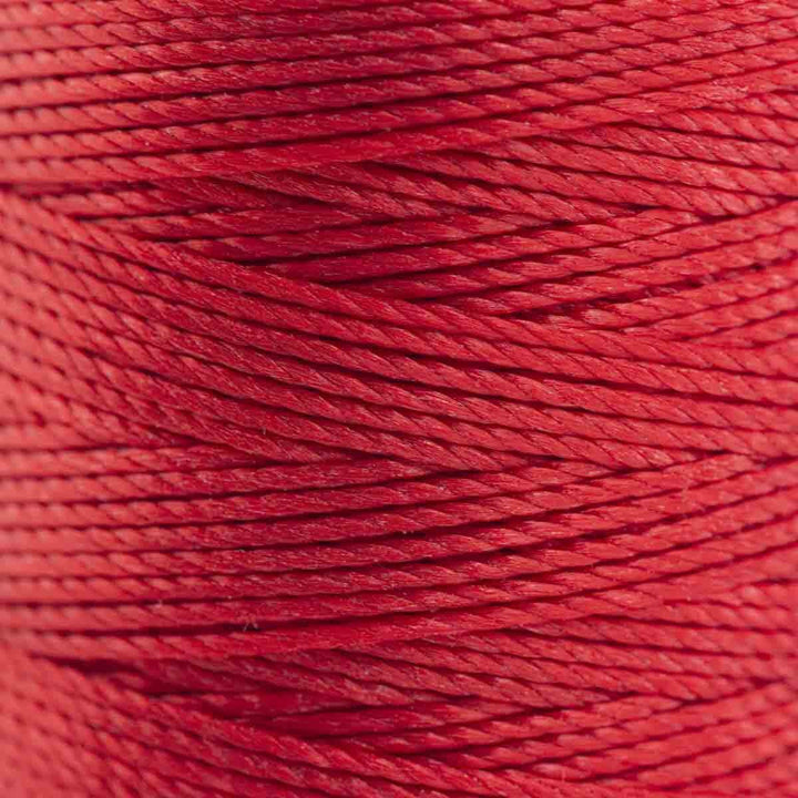 Close-up of Shanghai red 3-ply bonded nylon S-Lon Bead Cord on spool