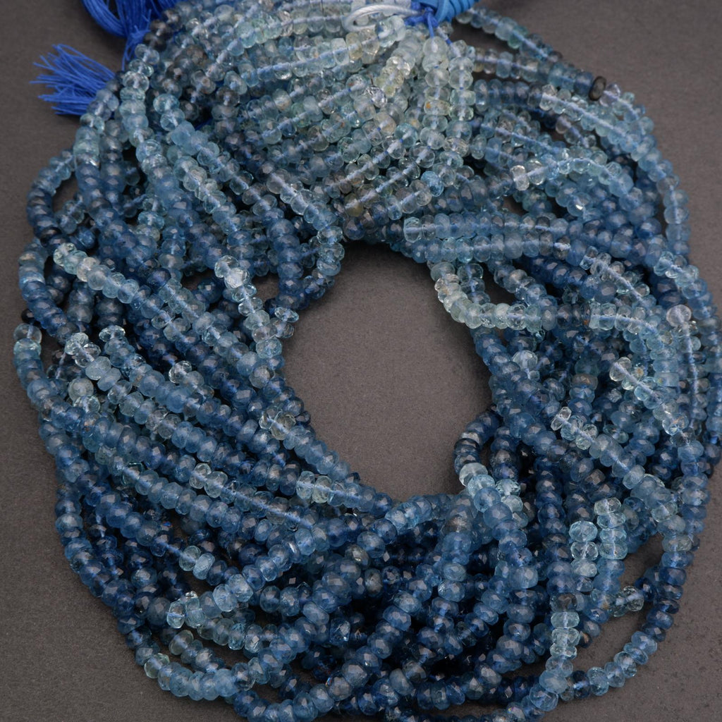Blue beaded necklace on a gray background