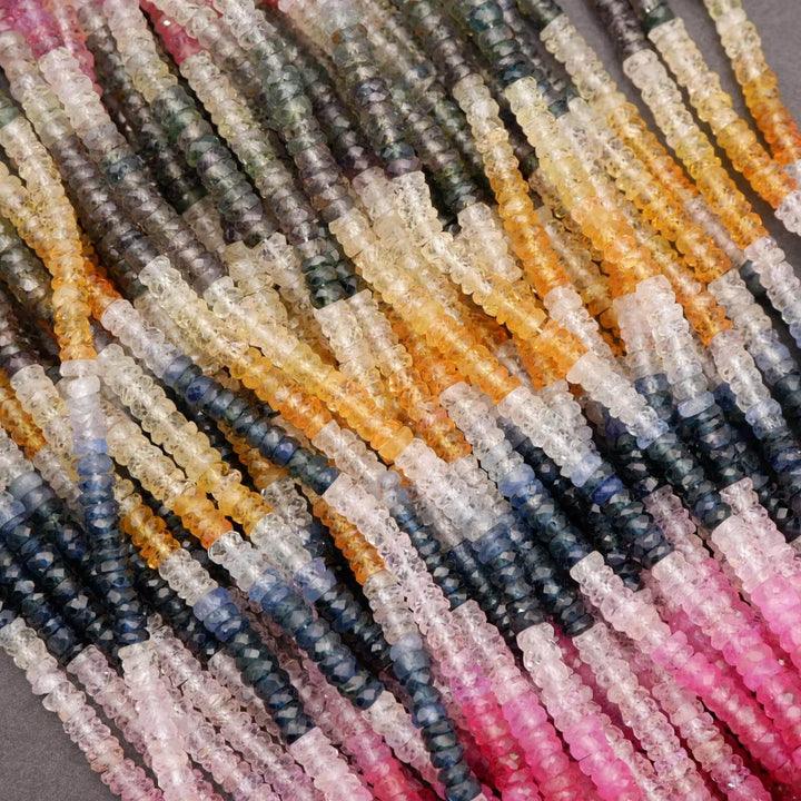 Close-up of multicolored glass beads on a gray background