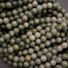 Close-up of green and white pearls on a dark background