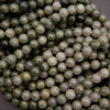 Close-up of green and white pearls on a dark background