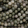 Close-up of green and gray marbled beads