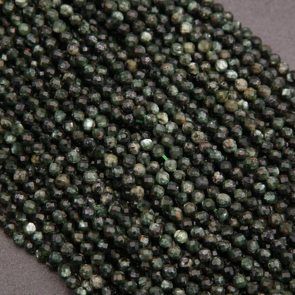 Close-up of green faceted beads on a gray background