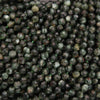 Close-up of dark green faceted beads
