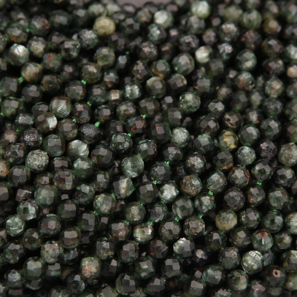 Close-up of dark green faceted beads