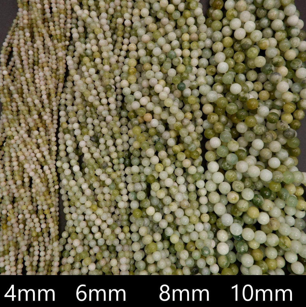 Close-up of green and white beads with size labels at the bottom.