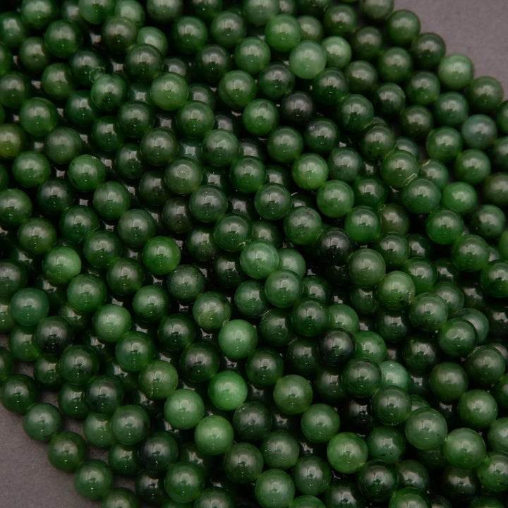 Close-up of green beads on a dark background