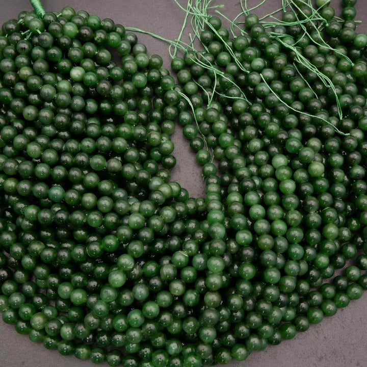 String of green beads on a gray background